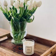 Load image into Gallery viewer, emo candle on tray in front of fresh flowers